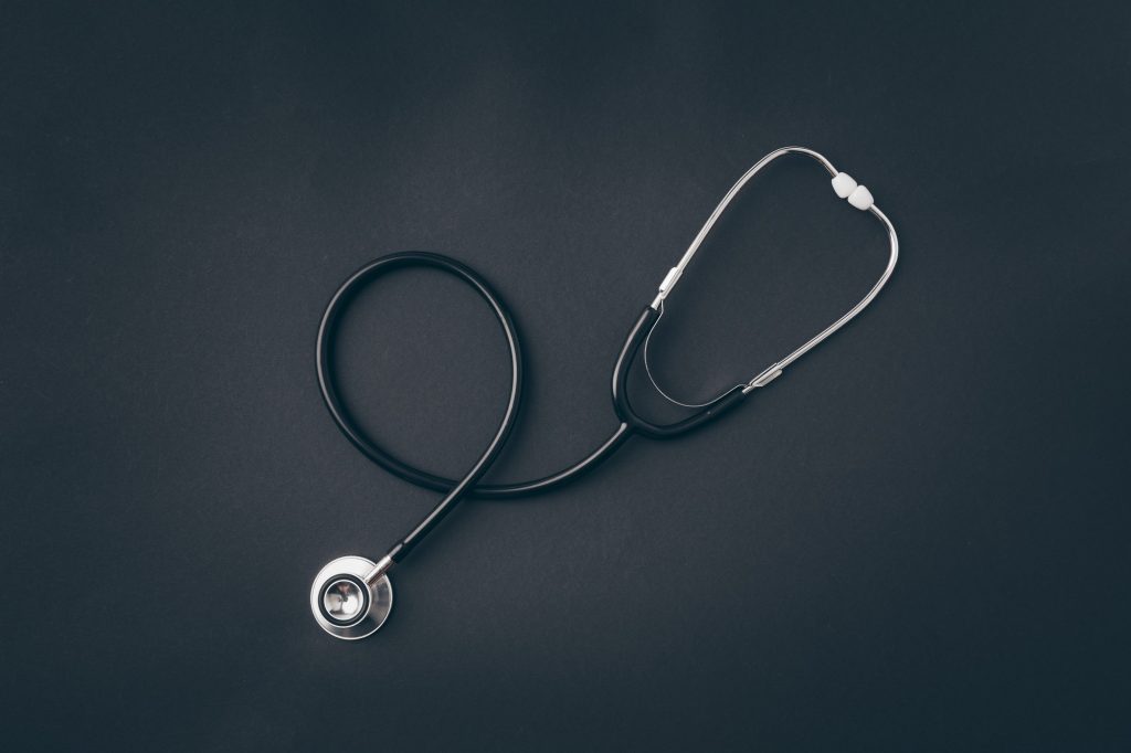 top view of stethoscope on gray surface